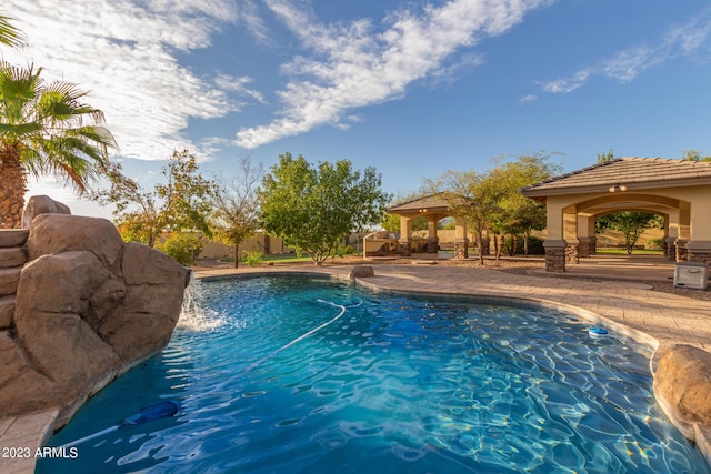 view of pool with a fenced in pool, a patio, and a gazebo