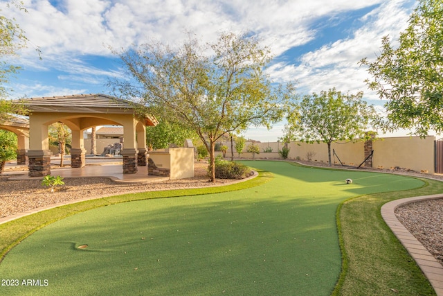 view of yard featuring a fenced backyard and a gazebo