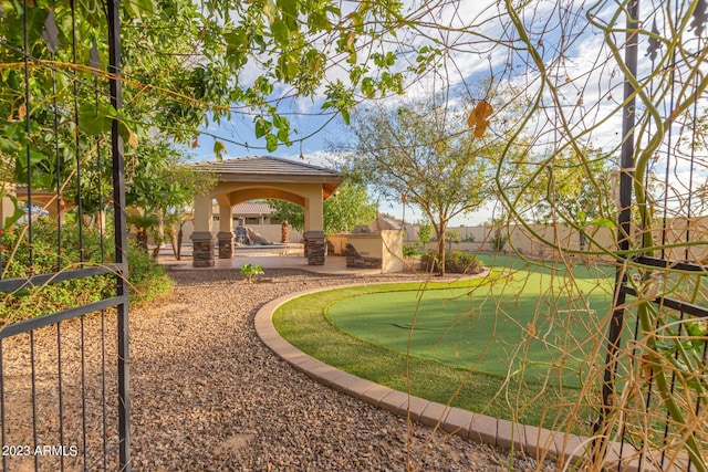 view of yard with a gazebo, a patio, and a fenced backyard