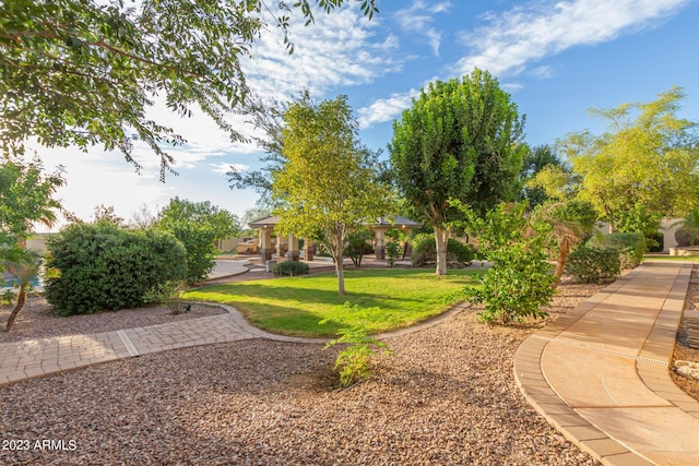 view of community with a gazebo and a lawn