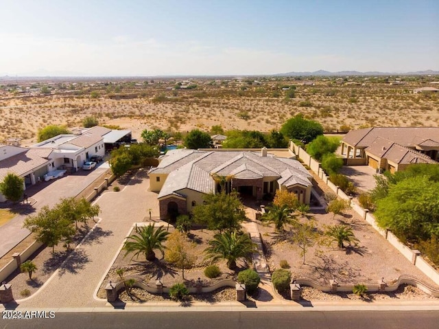 birds eye view of property with a desert view