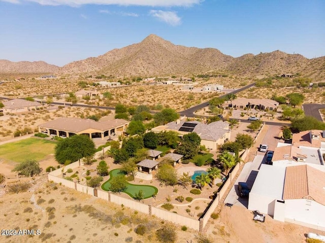 birds eye view of property with a desert view and a mountain view