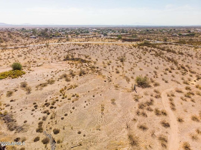 birds eye view of property featuring view of desert