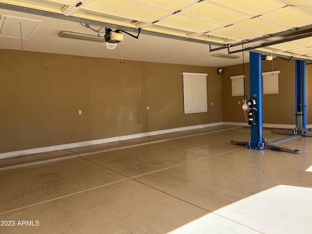 garage featuring baseboards and a garage door opener