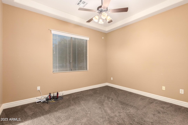 unfurnished room with a ceiling fan, carpet, visible vents, and baseboards