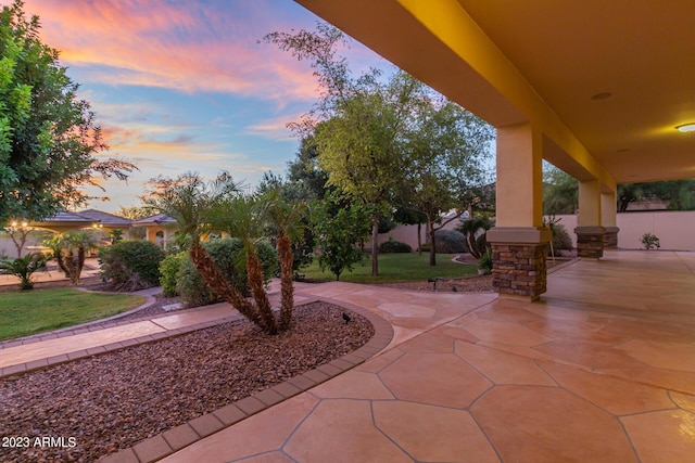 patio terrace at dusk with a lawn