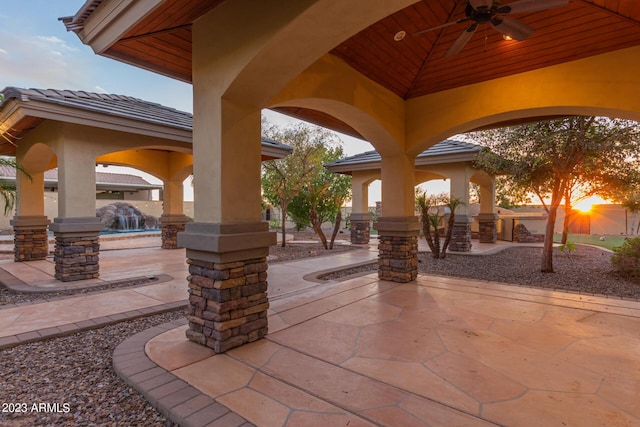 view of patio featuring ceiling fan and a gazebo