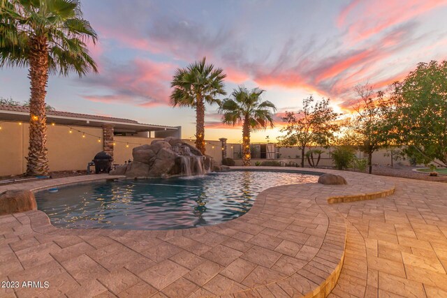 view of pool featuring a patio, fence, and a fenced in pool