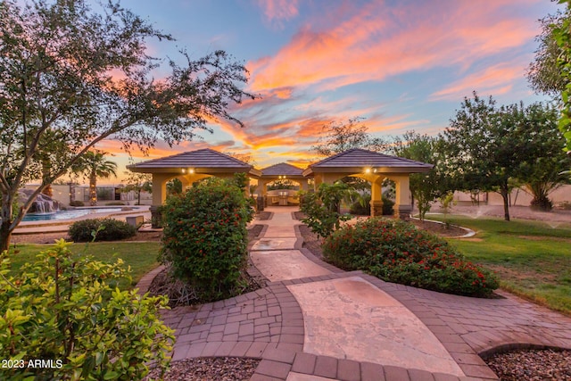 view of property's community with a yard, a gazebo, and a swimming pool