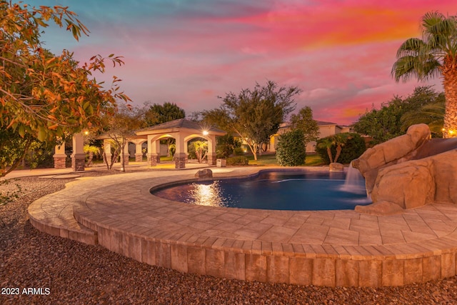 view of swimming pool featuring a gazebo