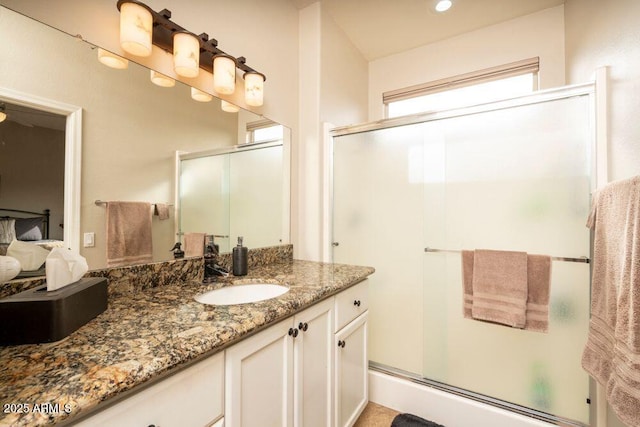 bathroom with vanity and walk in shower