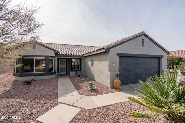 view of front of property featuring a garage