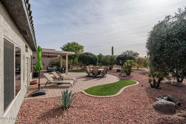 view of yard with a pergola and a patio