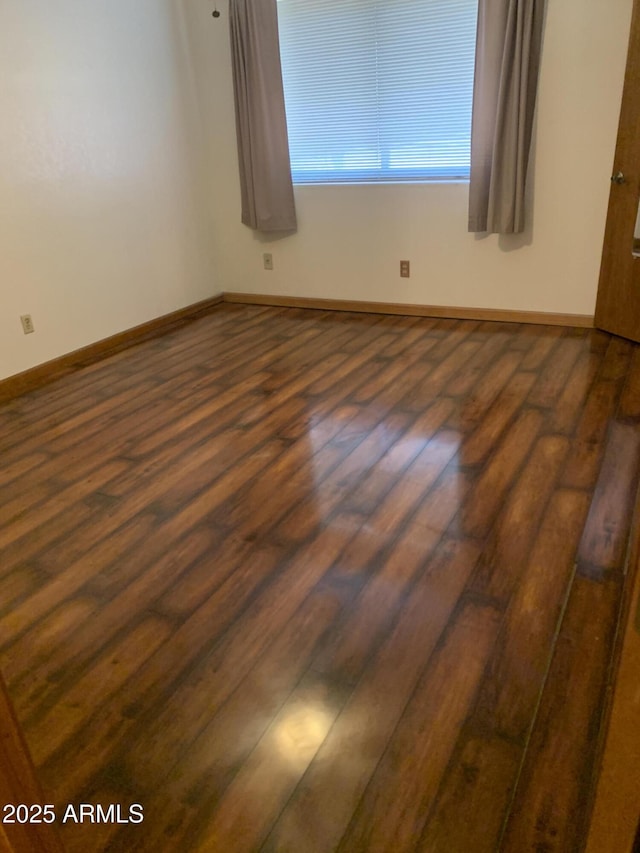 108 E Jasmine St, Mesa, AZ 85201 - empty room featuring dark wood-style floors and baseboards