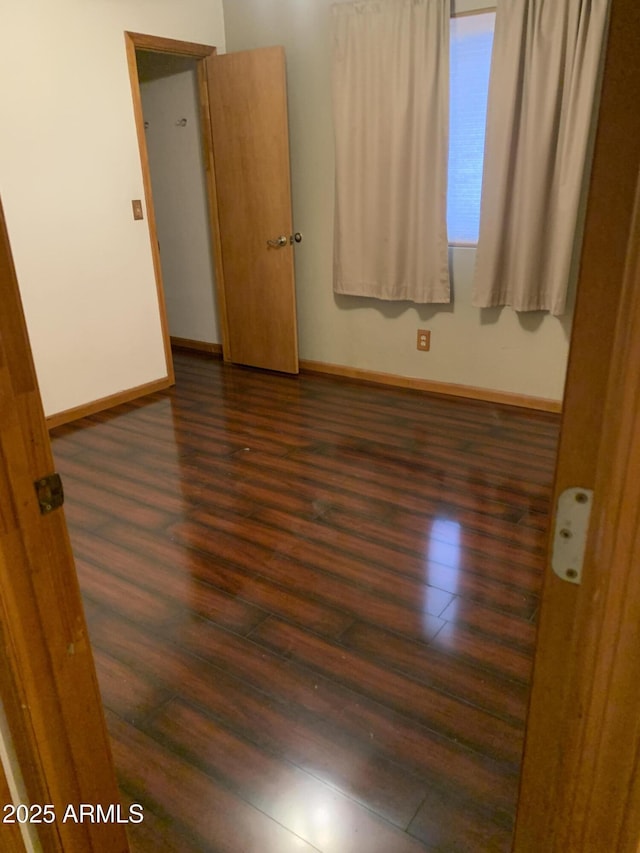 108 E Jasmine St, Mesa, AZ 85201 - unfurnished room featuring dark wood-style flooring and baseboards