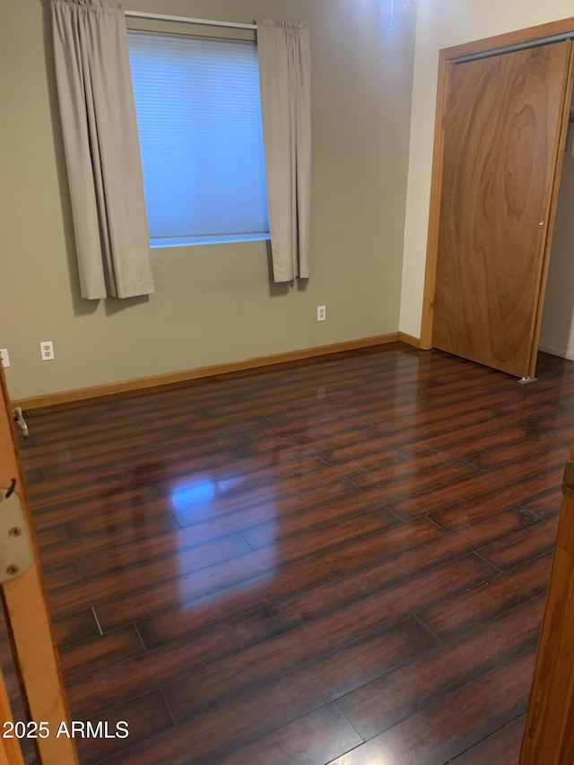 108 E Jasmine St, Mesa, AZ 85201 - empty room featuring dark wood-type flooring and baseboards