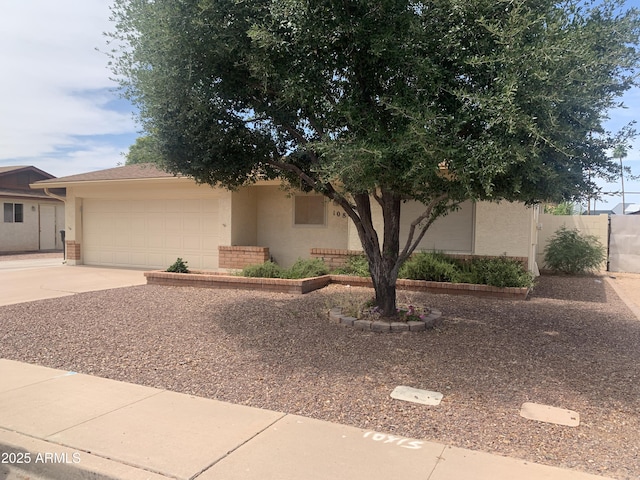 108 E Jasmine St, Mesa, AZ 85201 - view of front of house featuring concrete driveway, an attached garage, stucco siding, and brick siding