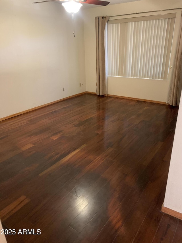 108 E Jasmine St, Mesa, AZ 85201 - empty room featuring baseboards, dark wood-style flooring, and ceiling fan
