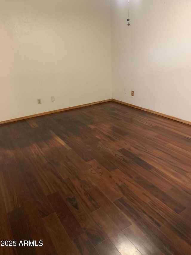 108 E Jasmine St, Mesa, AZ 85201 - spare room with dark wood-type flooring and baseboards