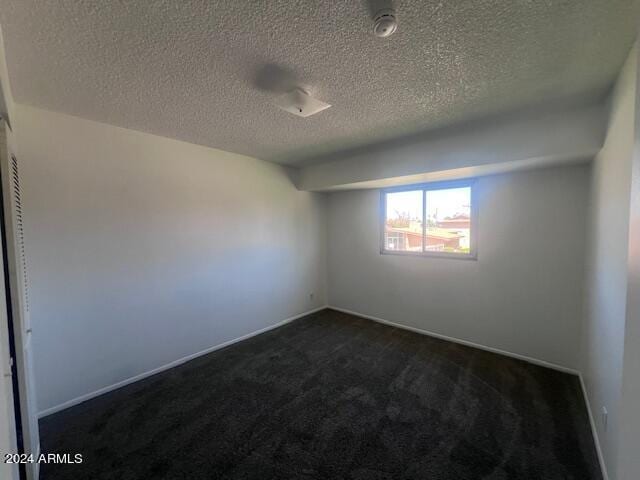 4332 W Ocotillo Rd Unit 206, Glendale, AZ 85301 - unfurnished room with dark colored carpet and a textured ceiling