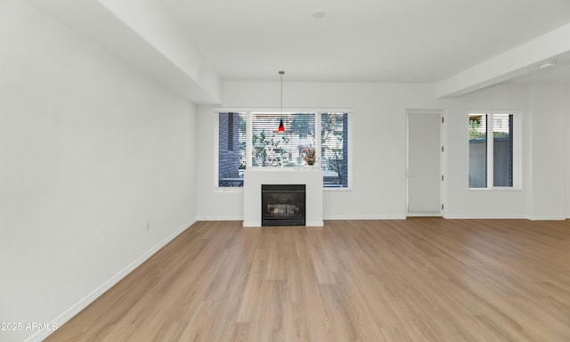 unfurnished living room with light wood-type flooring