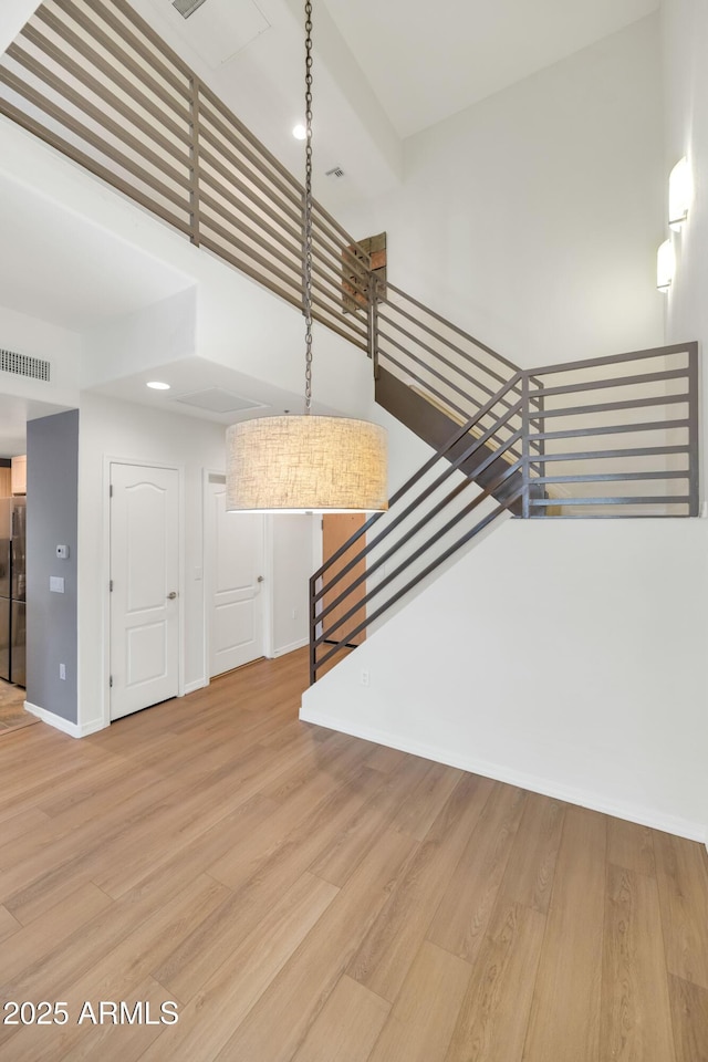 stairs with wood-type flooring