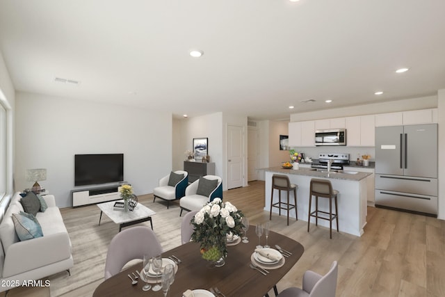 1213 N 13th St, Coolidge, AZ 85128 - living area with recessed lighting, light wood-style floors, and visible vents