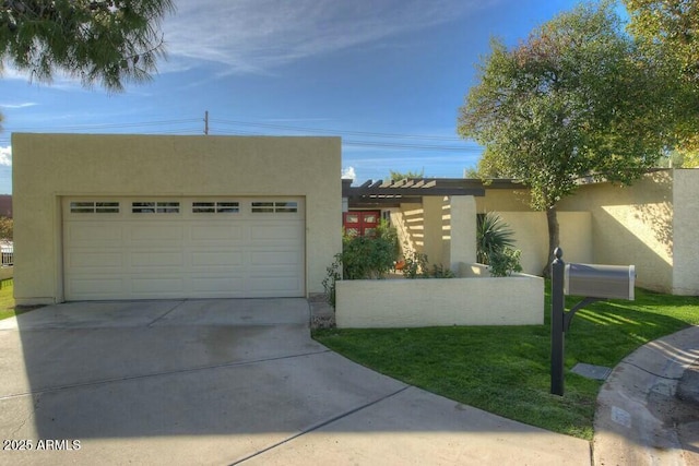 view of front of house featuring a garage and a front yard