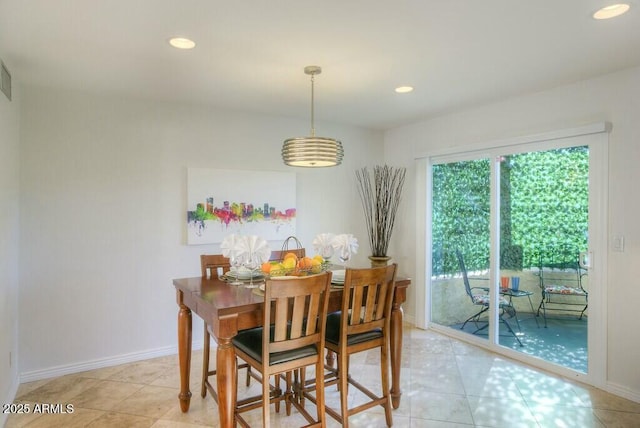 dining space featuring light tile patterned floors