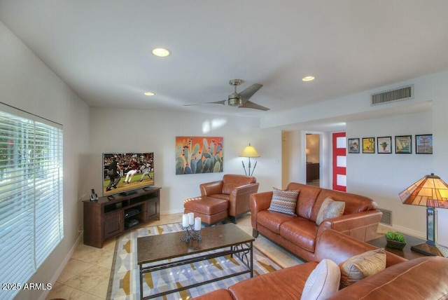 living room featuring ceiling fan and light tile patterned floors