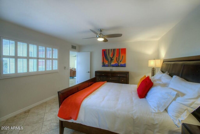 bedroom with ceiling fan and light tile patterned floors