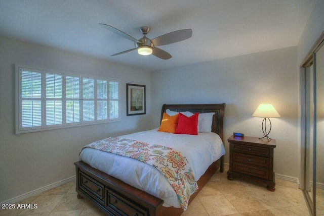 tiled bedroom with a closet and ceiling fan