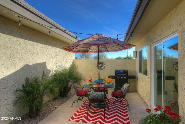 view of patio with a grill