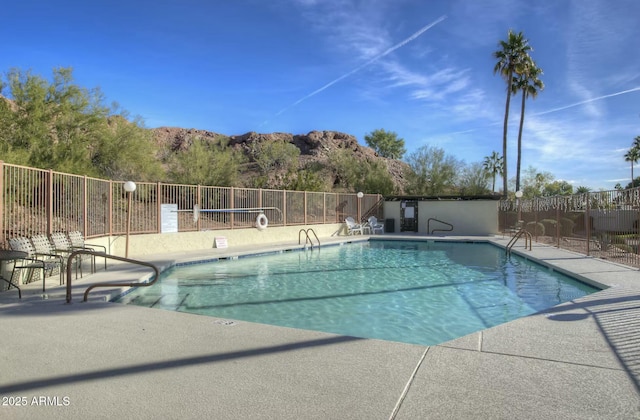 view of swimming pool featuring a patio area