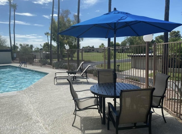 view of patio with a fenced in pool