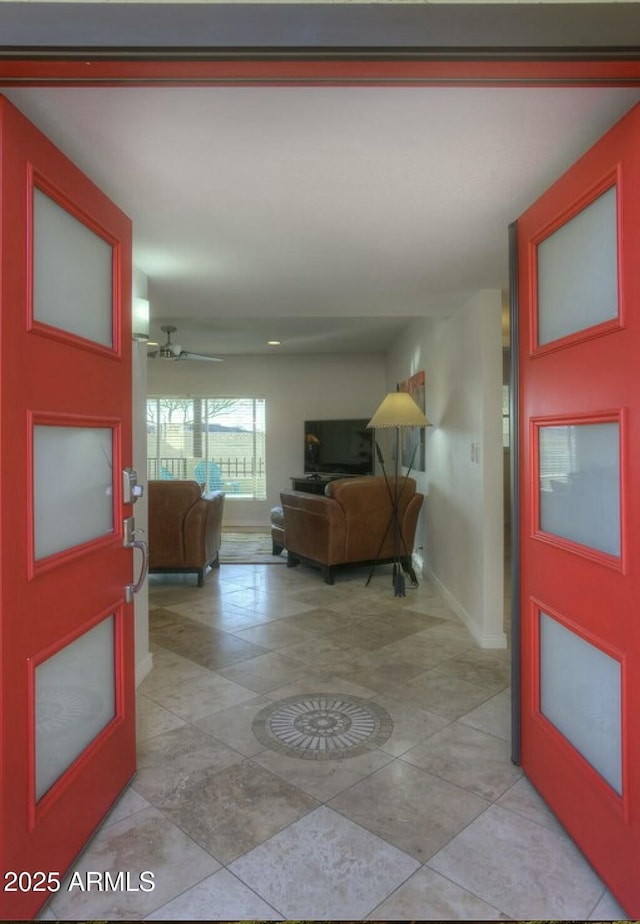 entryway featuring ceiling fan