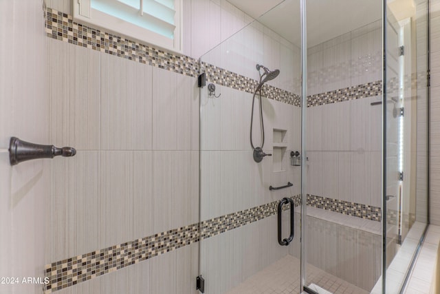 bathroom featuring a shower stall