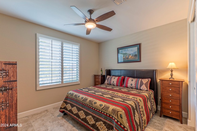 bedroom featuring a ceiling fan and baseboards