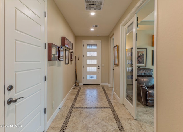 entryway featuring baseboards, visible vents, and recessed lighting
