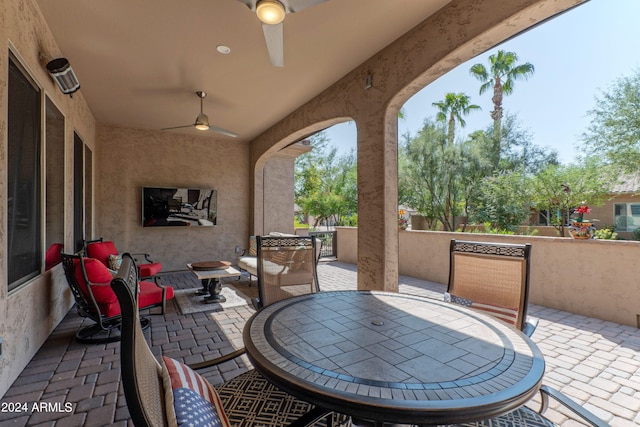 view of patio / terrace featuring ceiling fan and outdoor dining area