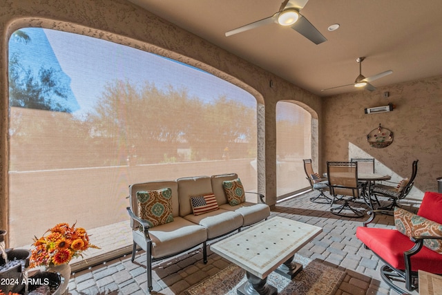view of patio featuring outdoor dining area, outdoor lounge area, and ceiling fan