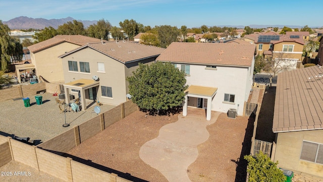 birds eye view of property with a mountain view