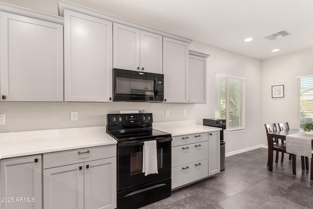 kitchen featuring black appliances and a healthy amount of sunlight