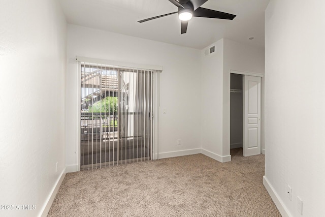 2019 E Campbell Ave Unit 110, Phoenix, AZ 85016 - unfurnished bedroom featuring carpet flooring, baseboards, and a closet