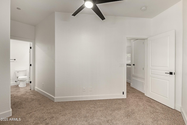 2019 E Campbell Ave Unit 110, Phoenix, AZ 85016 - unfurnished bedroom featuring carpet flooring, ensuite bathroom, and baseboards
