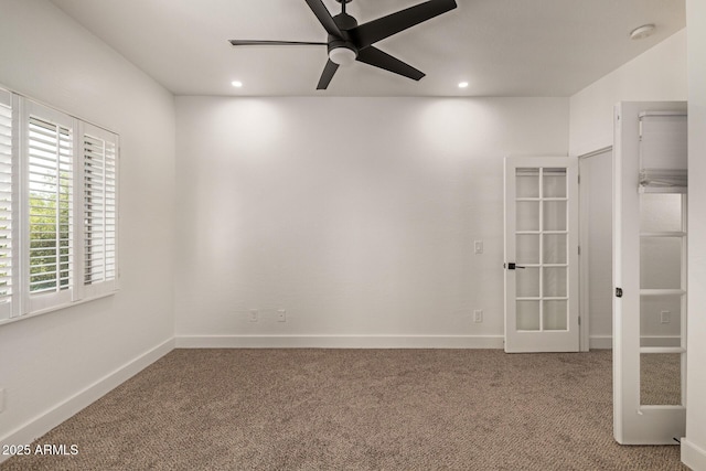 2019 E Campbell Ave Unit 110, Phoenix, AZ 85016 - carpeted empty room with french doors, a ceiling fan, a smoke detector, recessed lighting, and baseboards