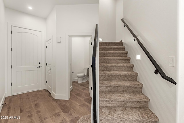 2019 E Campbell Ave Unit 110, Phoenix, AZ 85016 - staircase featuring wood finished floors, baseboards, and recessed lighting
