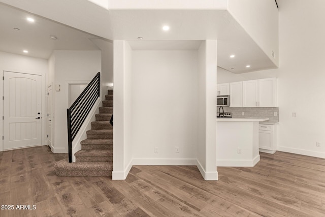 2019 E Campbell Ave Unit 110, Phoenix, AZ 85016 - entrance foyer with stairs, light wood-style floors, baseboards, and recessed lighting