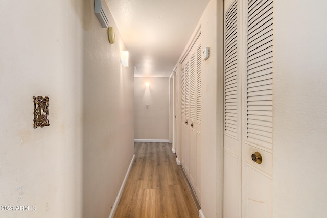 corridor featuring light hardwood / wood-style flooring