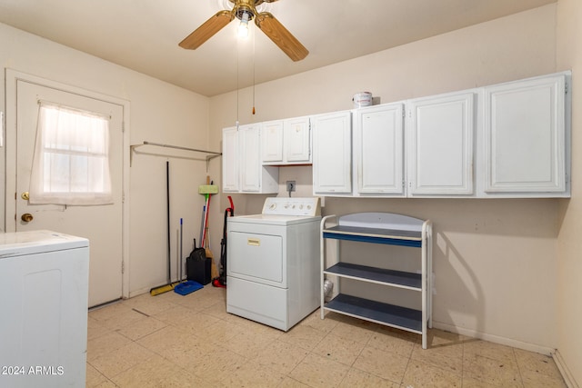 clothes washing area featuring cabinets, ceiling fan, and washing machine and dryer